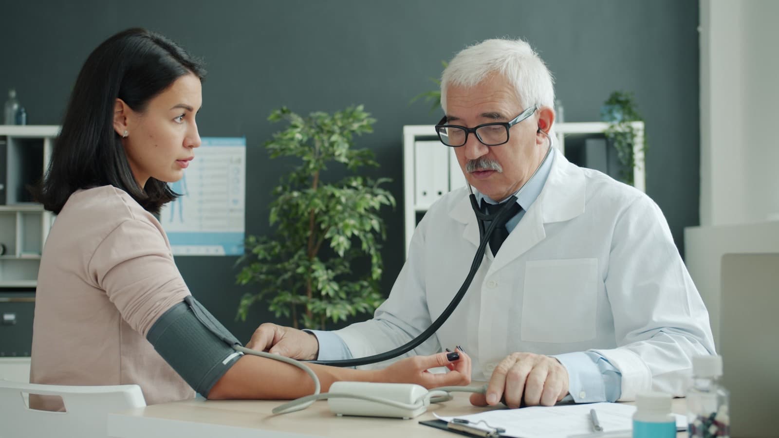 A physician carrying out a routine check-up in a modern consulting room